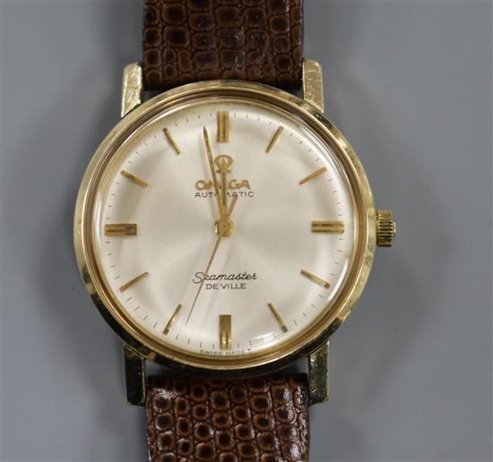 A gentlemans gold plated Omega Seamaster De Ville automatic mid-size wrist watch.